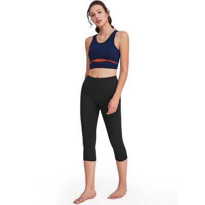 La yoga de funcionamiento de las mujeres de los pantalones de la yoga del poliéster fijó el sistema de las polainas de la aptitud del entrenamiento
