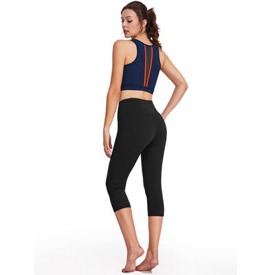 La yoga de funcionamiento de las mujeres de los pantalones de la yoga del poliéster fijó el sistema de las polainas de la aptitud del entrenamiento