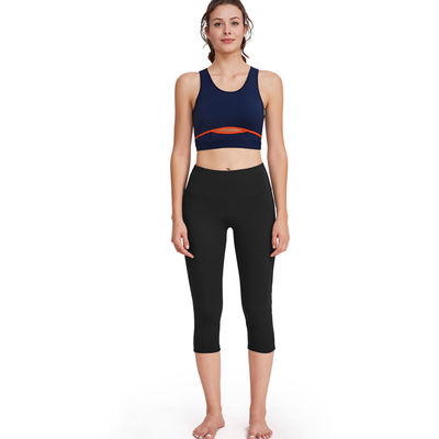 La yoga de funcionamiento de las mujeres de los pantalones de la yoga del poliéster fijó el sistema de las polainas de la aptitud del entrenamiento