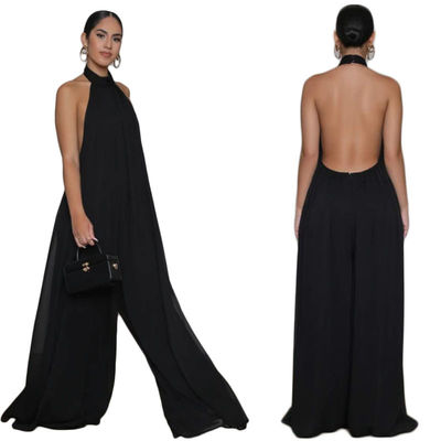 Las mujeres señalan por medio de luces de largo los pantalones casuales de la pierna ancha floja del mono de la manga