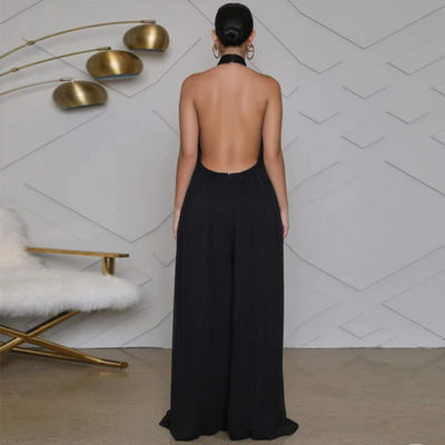 Las mujeres señalan por medio de luces de largo los pantalones casuales de la pierna ancha floja del mono de la manga